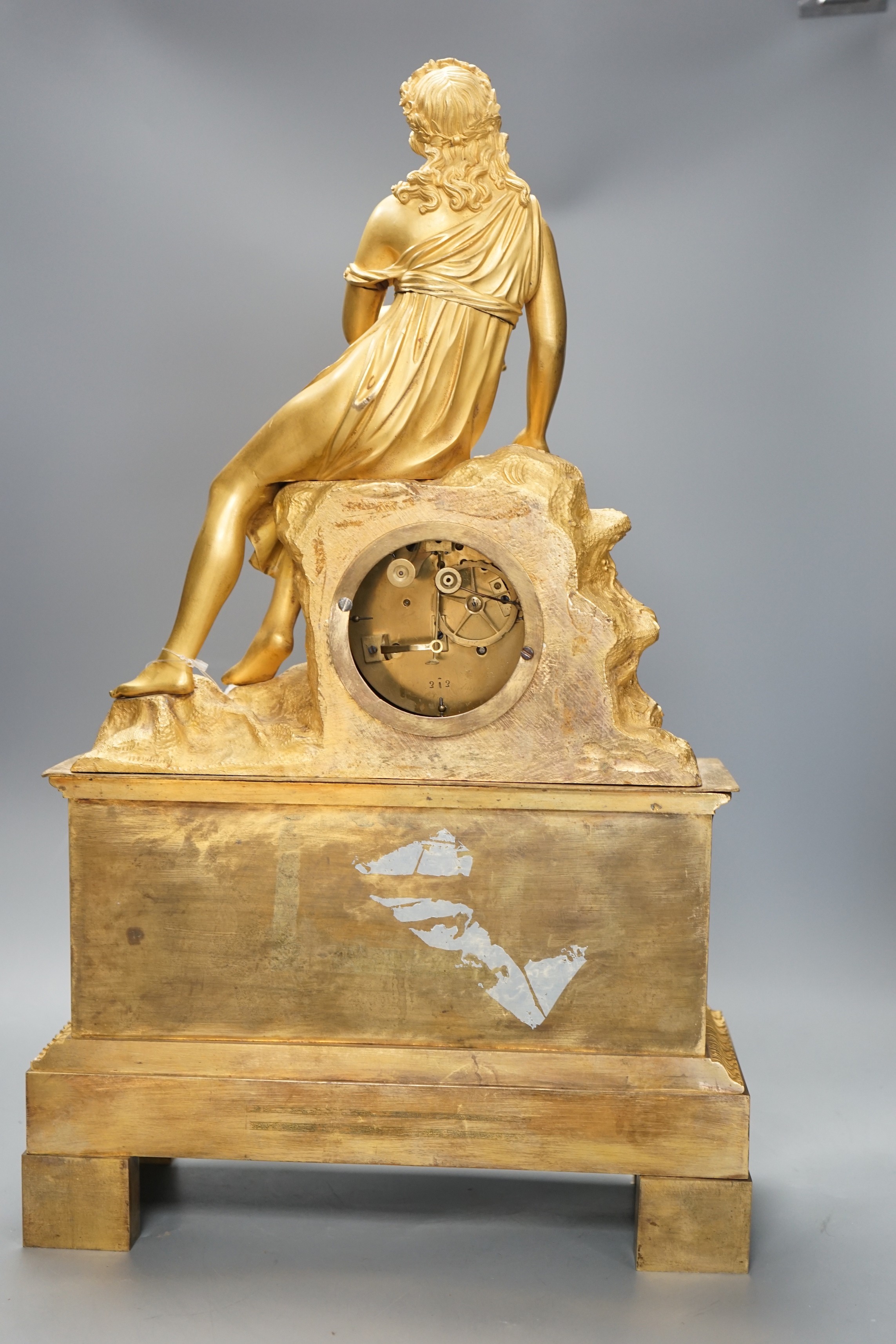 A 19th century French 'Pipe player' ormolu clock, 57cm tall